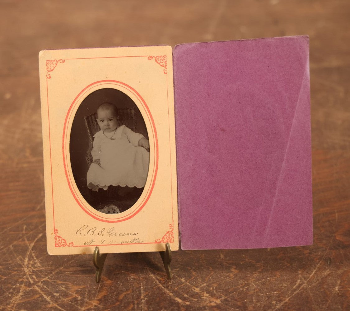 Lot 094 - Single Tintype Photo, Baby Identified As R.B.S. Greene At 8 Months Old, In Paper Folder, Kenefick Lawrence Photographers