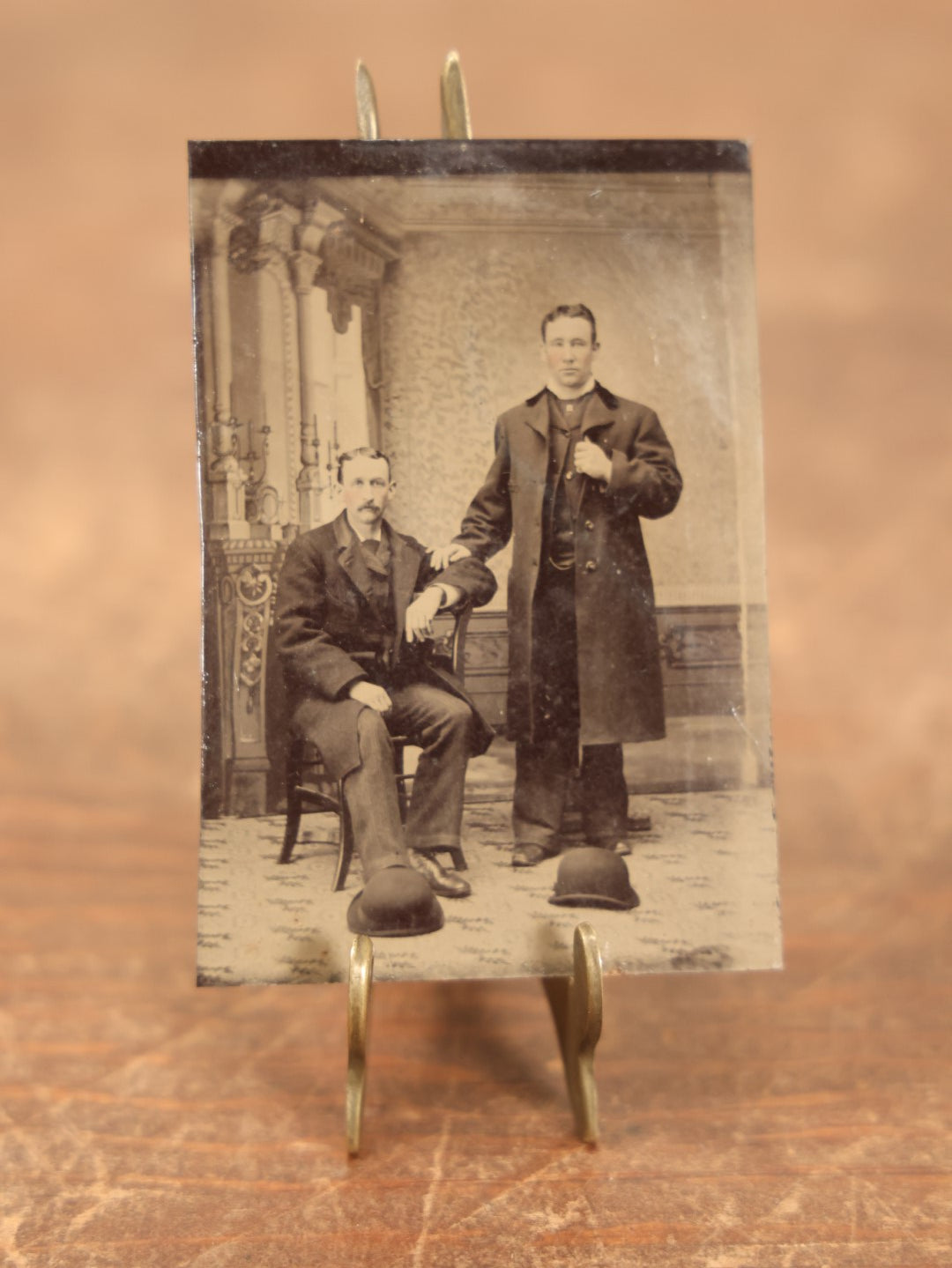 Lot 096 - Single Tintype Photo, Two Men, One Sitting One Standing, With Bowler Hats On The Floor