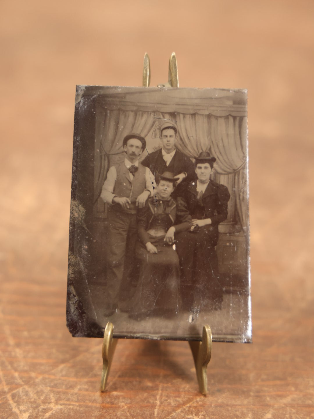 Lot 100 - Single Tintype Photo, Two Men And Two Women, Sitting And Standing, With Drapery