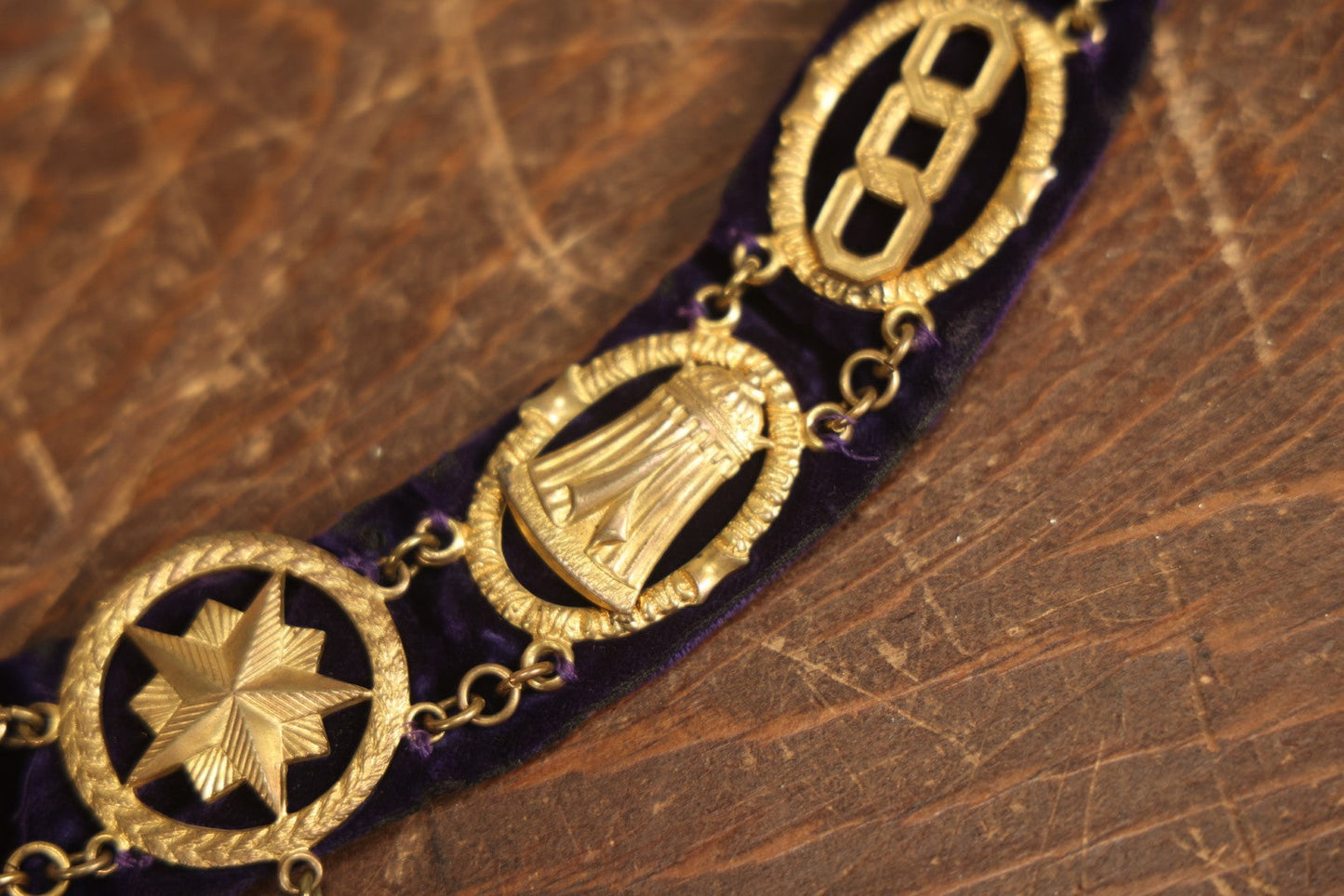 Lot 052 - Antique Odd Fellows I.O.O.F. Purple Chain Collar With Many Symbols Including Three Links And Heart In Hand, With Crossed Swords Medallion, By Harding Uniform & Regalia Company, Boston