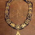 Lot 053 - Antique Odd Fellows I.O.O.F. Purple Chain Collar With Many Symbols Including Three Links And Heart In Hand, With Flaming Pedestal, Crossed Staffs Medallion By Harding Uniform & Regalia Company, Boston