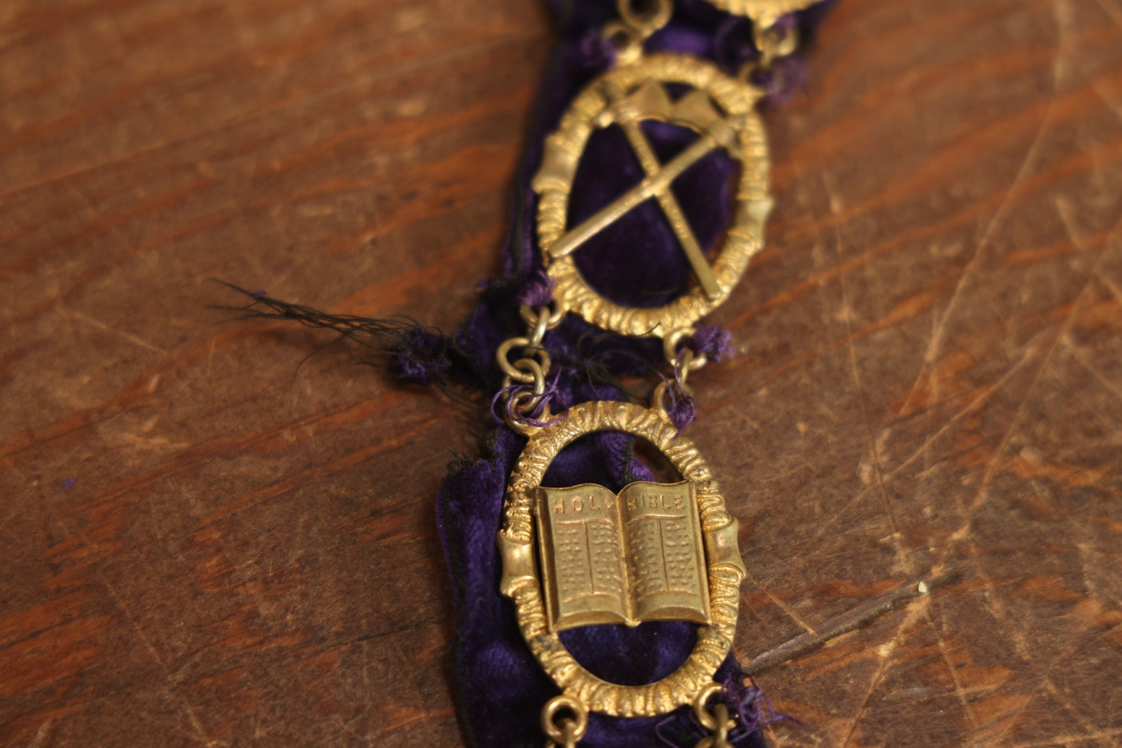 Lot 053 - Antique Odd Fellows I.O.O.F. Purple Chain Collar With Many Symbols Including Three Links And Heart In Hand, With Flaming Pedestal, Crossed Staffs Medallion By Harding Uniform & Regalia Company, Boston