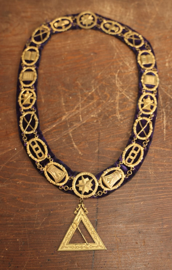 Lot 055 - Antique Odd Fellows I.O.O.F. Purple Chain Collar With Many Symbols Including Three Links And Heart In Hand, With Single Staff Medallion, By Harding Uniform & Regalia Company, Boston