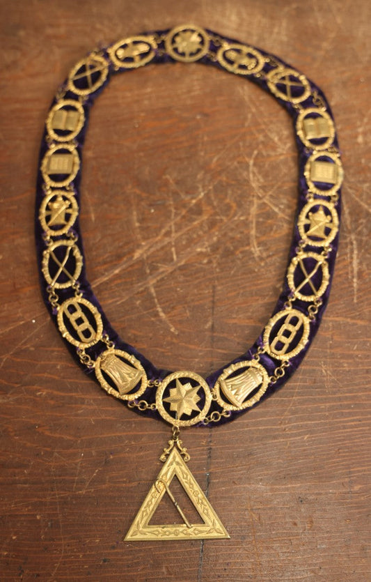 Lot 055 - Antique Odd Fellows I.O.O.F. Purple Chain Collar With Many Symbols Including Three Links And Heart In Hand, With Single Staff Medallion, By Harding Uniform & Regalia Company, Boston