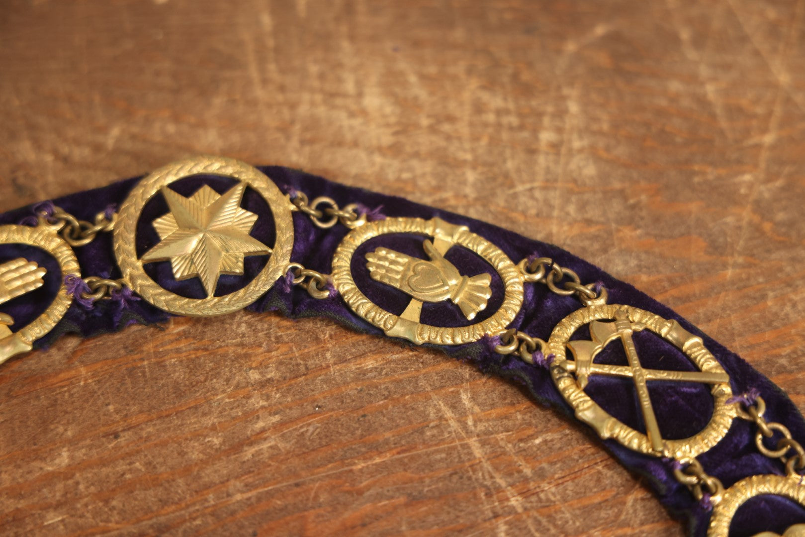 Lot 055 - Antique Odd Fellows I.O.O.F. Purple Chain Collar With Many Symbols Including Three Links And Heart In Hand, With Single Staff Medallion, By Harding Uniform & Regalia Company, Boston