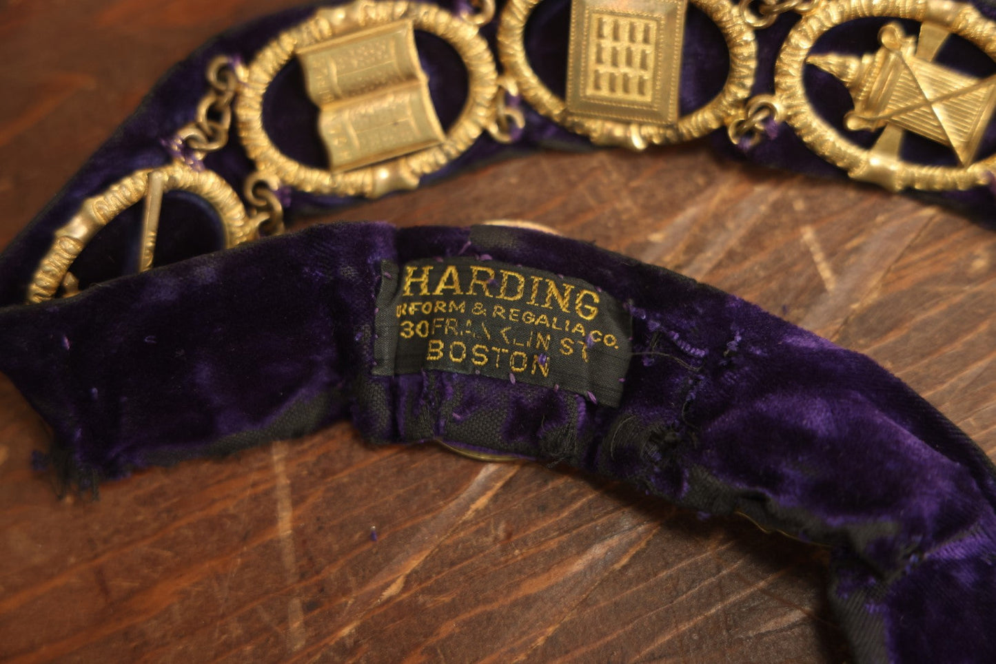 Lot 055 - Antique Odd Fellows I.O.O.F. Purple Chain Collar With Many Symbols Including Three Links And Heart In Hand, With Single Staff Medallion, By Harding Uniform & Regalia Company, Boston