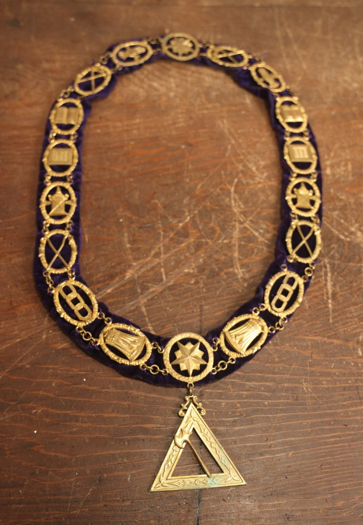 Lot 057 - Antique Odd Fellows I.O.O.F. Purple Chain Collar With Many Symbols Including Three Links And Heart In Hand, With Battle Axe Medallion, By Harding Uniform & Regalia Company, Boston