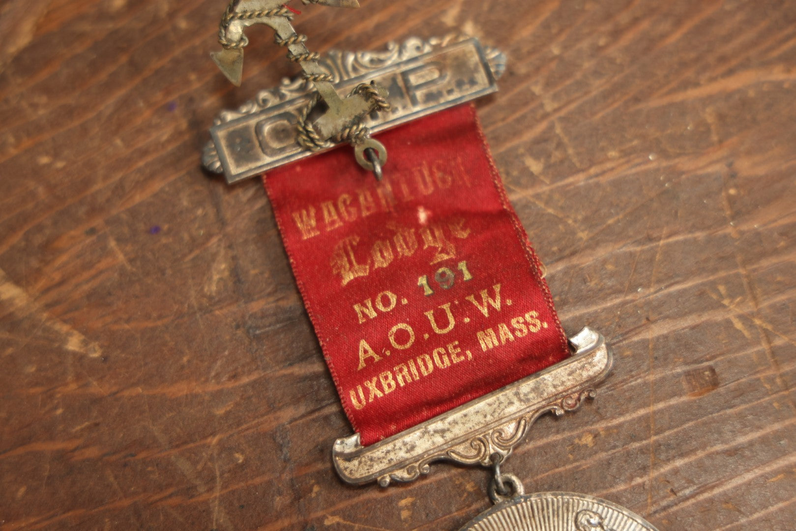 Lot 058 - Antique Ancient Order Of United Workmen A.O.U.M. Ribbon And Medallion, Wacantuck Lodge No 191, Uxbridge, Massachusetts, C.H.P., With Anchor Charm, By The Boston Regalia Company, Missing Pin