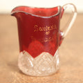 Lot 080 - Antique E.A.P.G. Early American Pattern Glass Red And Clear Syrup Or Creamer, Souvenir Of Friendship, Wisconsin