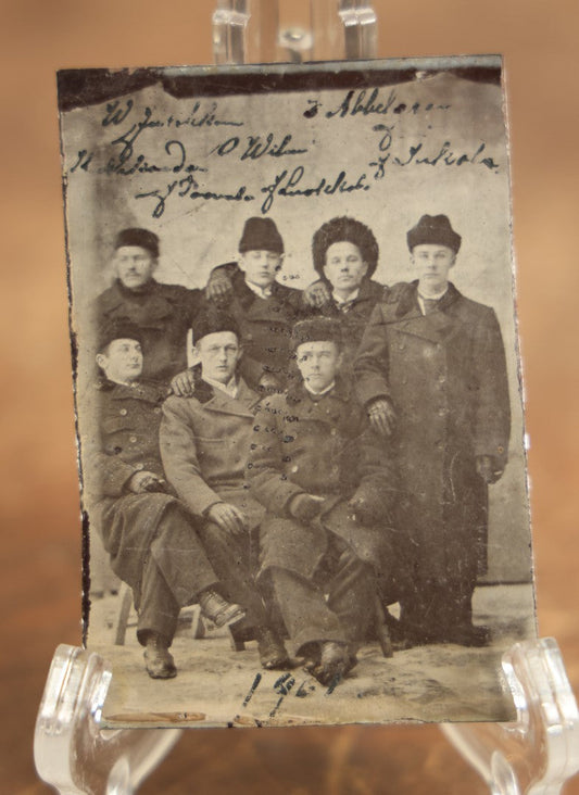 Lot 081 - Antique Identified Tintype Photograph Of Eight Young Men In Coats And Fur Hats, Possibly Russian, Names Written On Photo