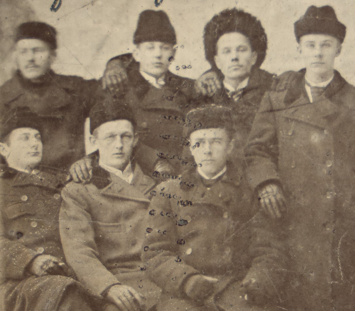 Lot 081 - Antique Identified Tintype Photograph Of Eight Young Men In Coats And Fur Hats, Possibly Russian, Names Written On Photo