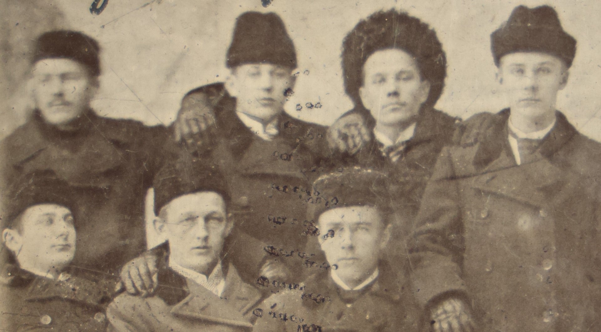 Lot 081 - Antique Identified Tintype Photograph Of Eight Young Men In Coats And Fur Hats, Possibly Russian, Names Written On Photo