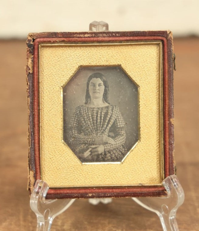 Lot 010 - Antique 1/6th Plate Daguerreotype Photograph Of A Pretty Young Woman With Curls And A Dress Holding A Book, In Half Case, With Octogonal Cut Mat