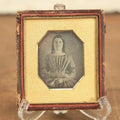 Lot 010 - Antique 1/6th Plate Daguerreotype Photograph Of A Pretty Young Woman With Curls And A Dress Holding A Book, In Half Case, With Octogonal Cut Mat