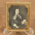 Lot 011 - Antique 1/6th Plate Daguerreotype Of A Young Woman With Short Dark Hair, A Ribbon, Bracelet, And Ring, Under Brass Mat, No Case