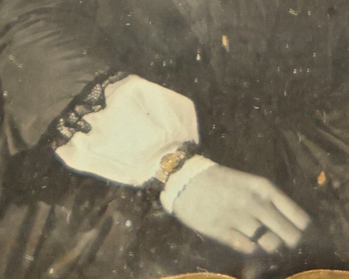 Lot 011 - Antique 1/6th Plate Daguerreotype Of A Young Woman With Short Dark Hair, A Ribbon, Bracelet, And Ring, Under Brass Mat, No Case