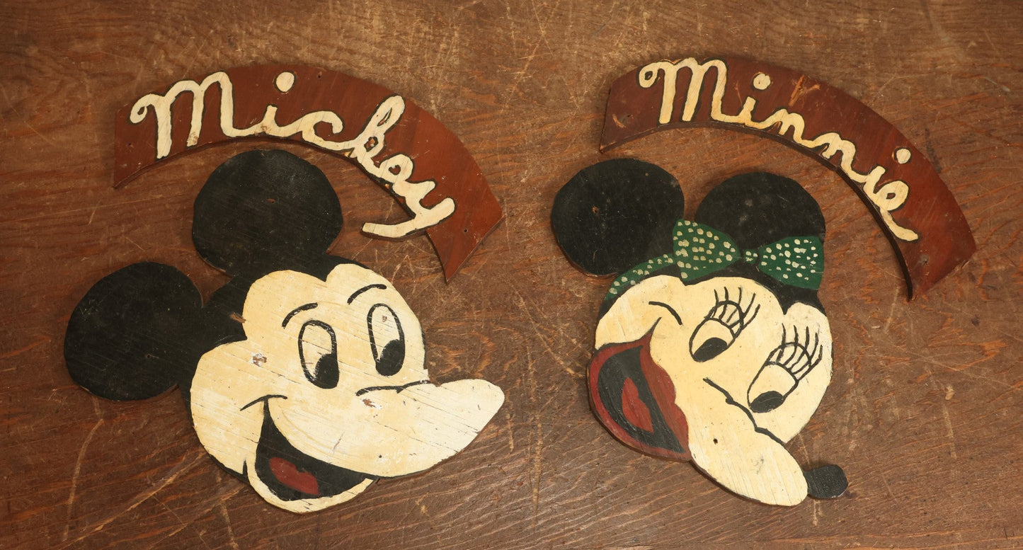 Lot 021 - Pair Of Vintage Folk Art Mickey Mouse And Minnie Mouse Scroll Cut Wood Faces, Hand Painted, With Name Ribbons, Note Mickey Missing Nose