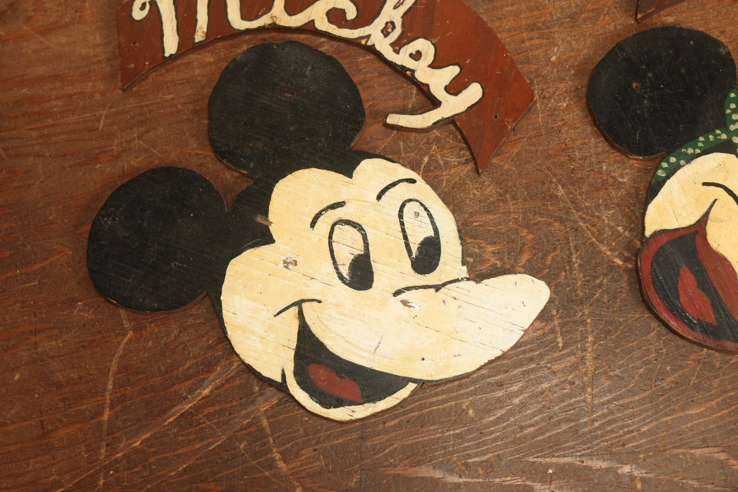 Lot 021 - Pair Of Vintage Folk Art Mickey Mouse And Minnie Mouse Scroll Cut Wood Faces, Hand Painted, With Name Ribbons, Note Mickey Missing Nose