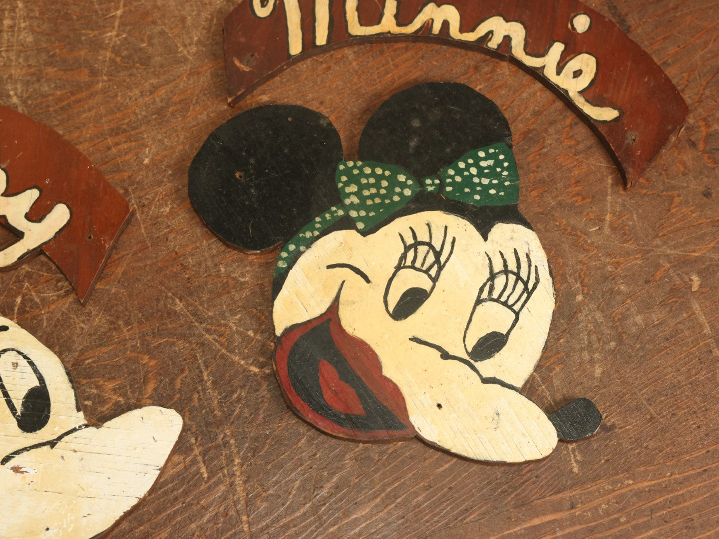 Lot 021 - Pair Of Vintage Folk Art Mickey Mouse And Minnie Mouse Scroll Cut Wood Faces, Hand Painted, With Name Ribbons, Note Mickey Missing Nose