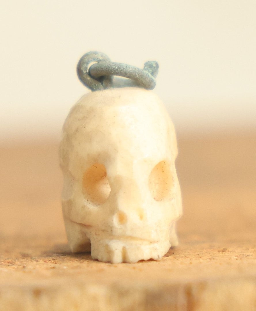 Lot 022 - Vintage Miniature Carved Bone Skull Charm With Hoop