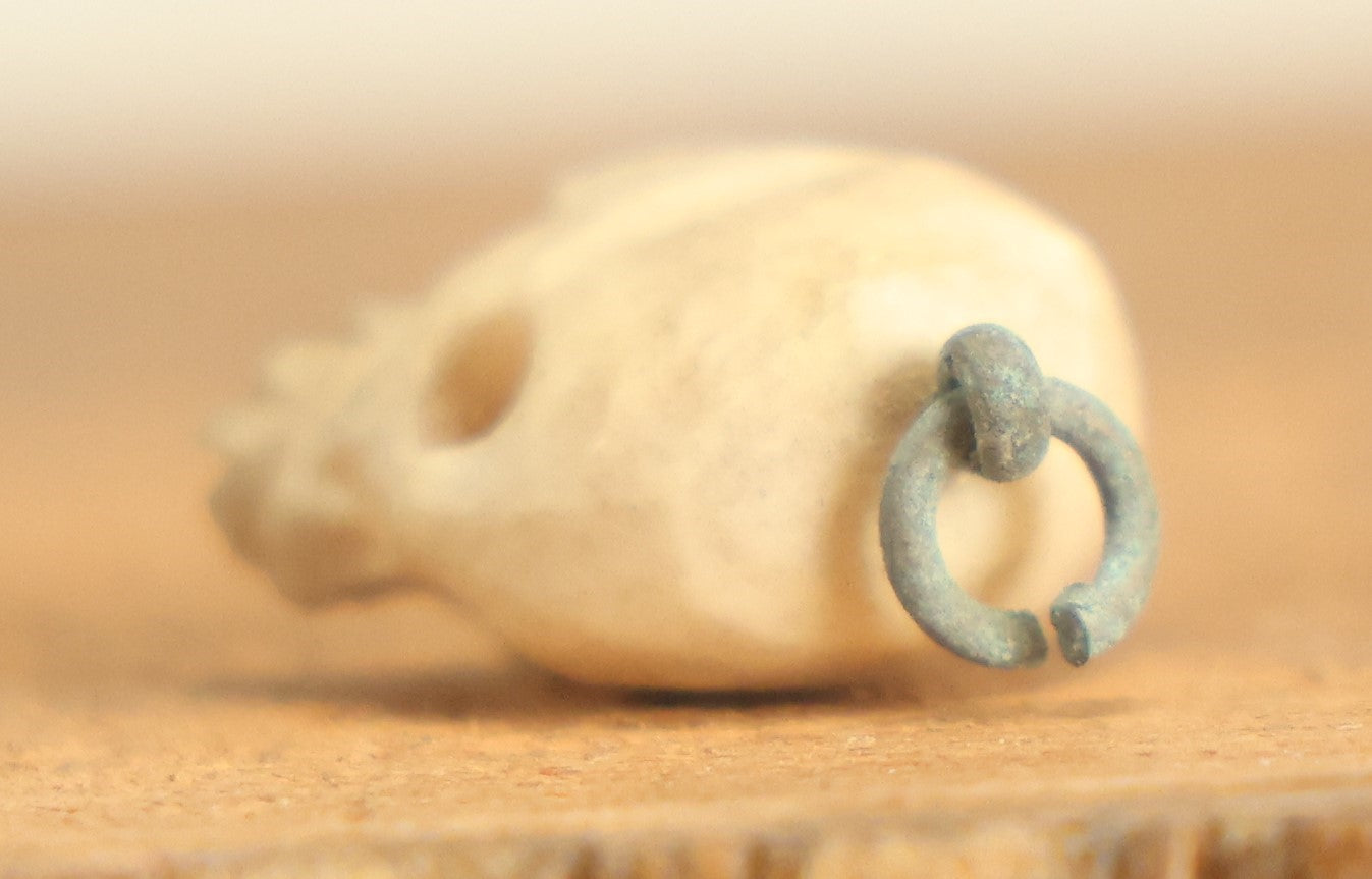 Lot 022 - Vintage Miniature Carved Bone Skull Charm With Hoop