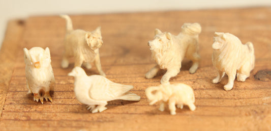 Lot 023 - Grouping Of Six Miniature Carved Bone Animals: Cat, Owl, Pigeon, Elephant, And Two Dogs, Plus Two Bonus Wooden Animals