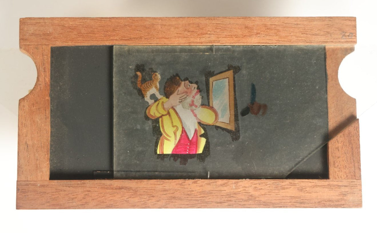 Lot 038 - Antique Hand Painted Animated Magic Lantern Motion Slide, Shaving Man Cuts Face When Cat Scares Him