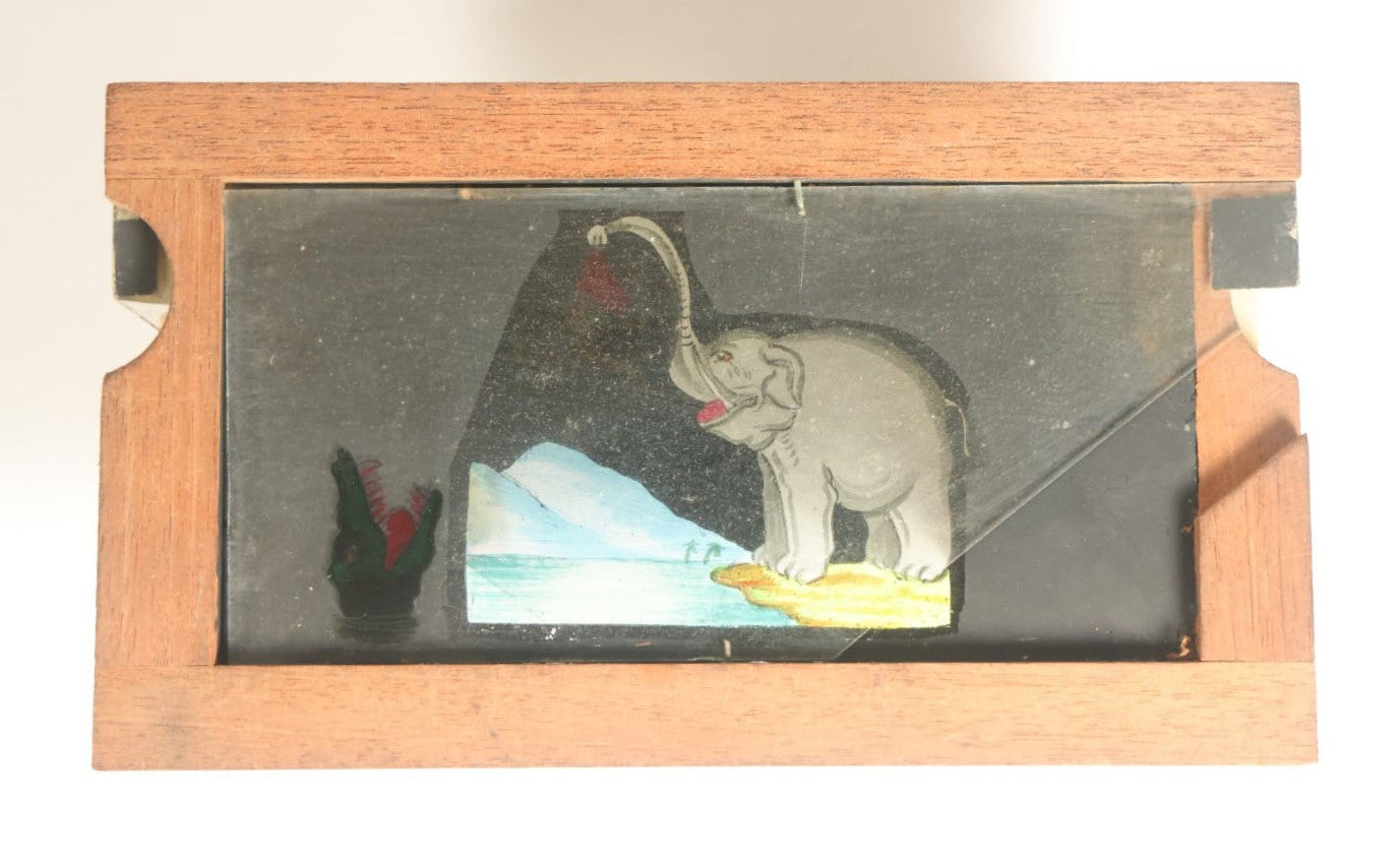 Lot 039 - Antique Hand Painted Animated Magic Lantern Motion Slide, Elephant Feeding Monkey To Crocodile