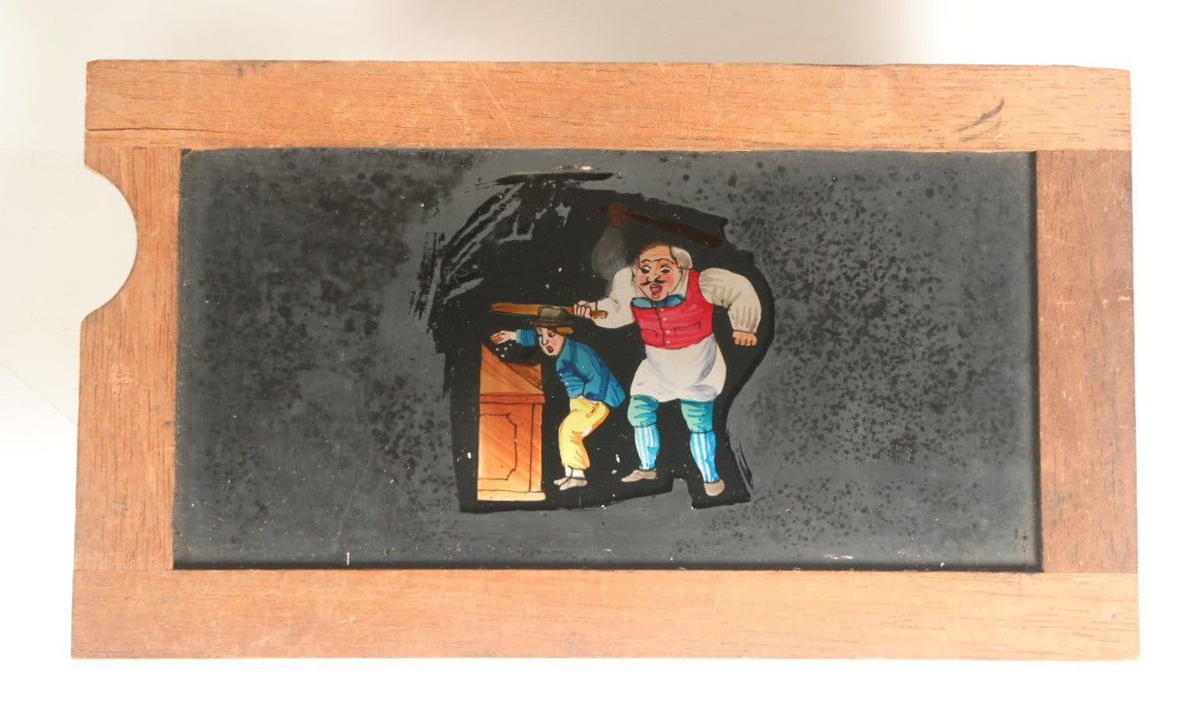 Lot 041 - Antique Hand Painted Animated Magic Lantern Motion Slide, Shopkeeper Batting Boy Stealing