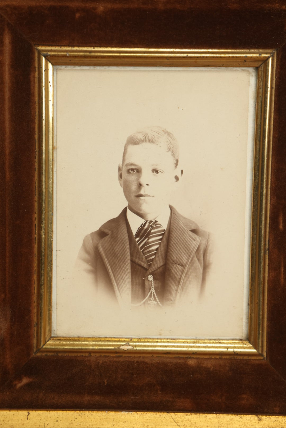 Lot 057 - Antique Cabinet Card Photo Of A Young Man In A Tie In Deep Frame With Velvet Surround, Gilded Embellishments