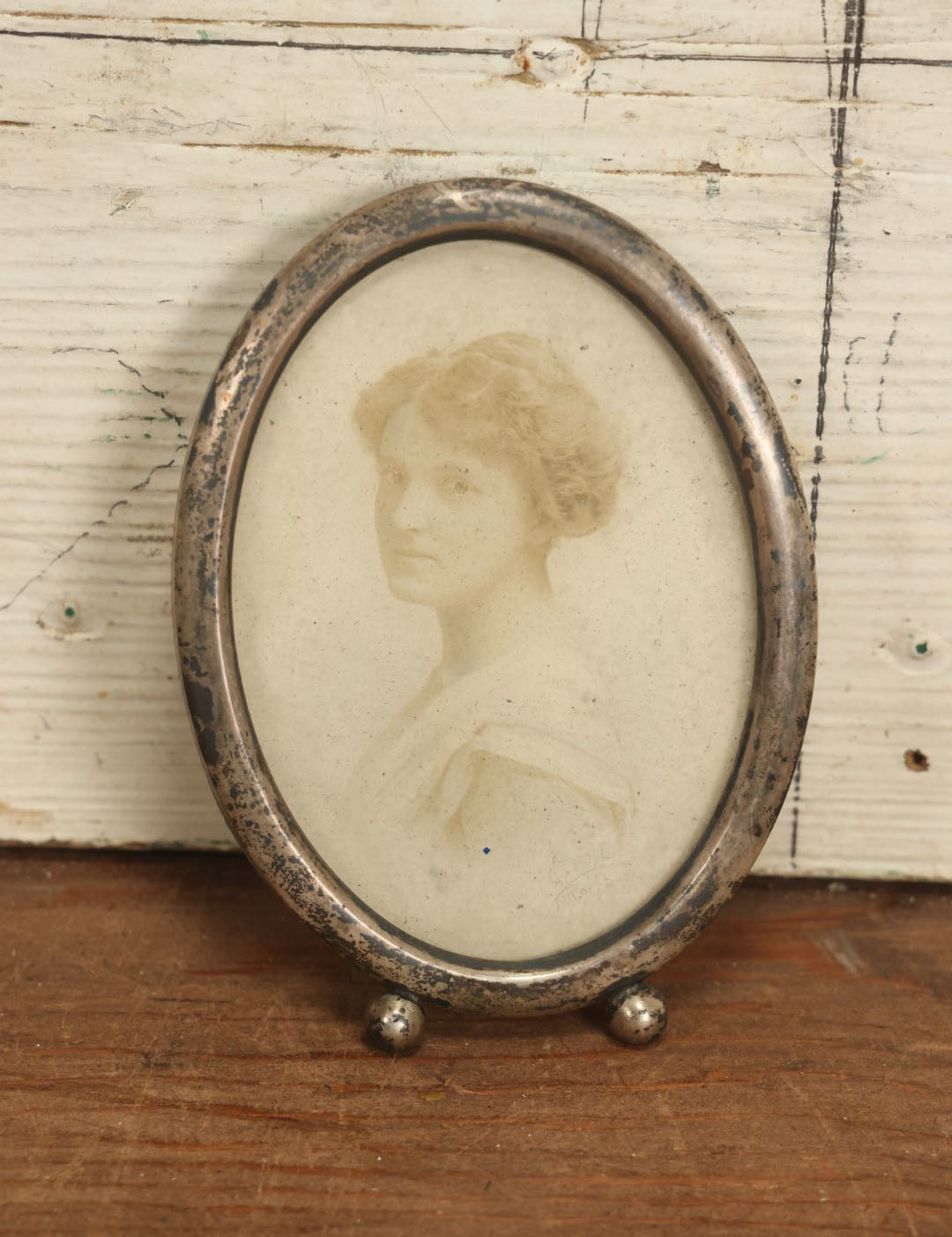 Lot 064 - Antique Photo Of Young Woman In Tarnished Sterling Silver Oval Frame, Missing Kickstand, Marked Sterling