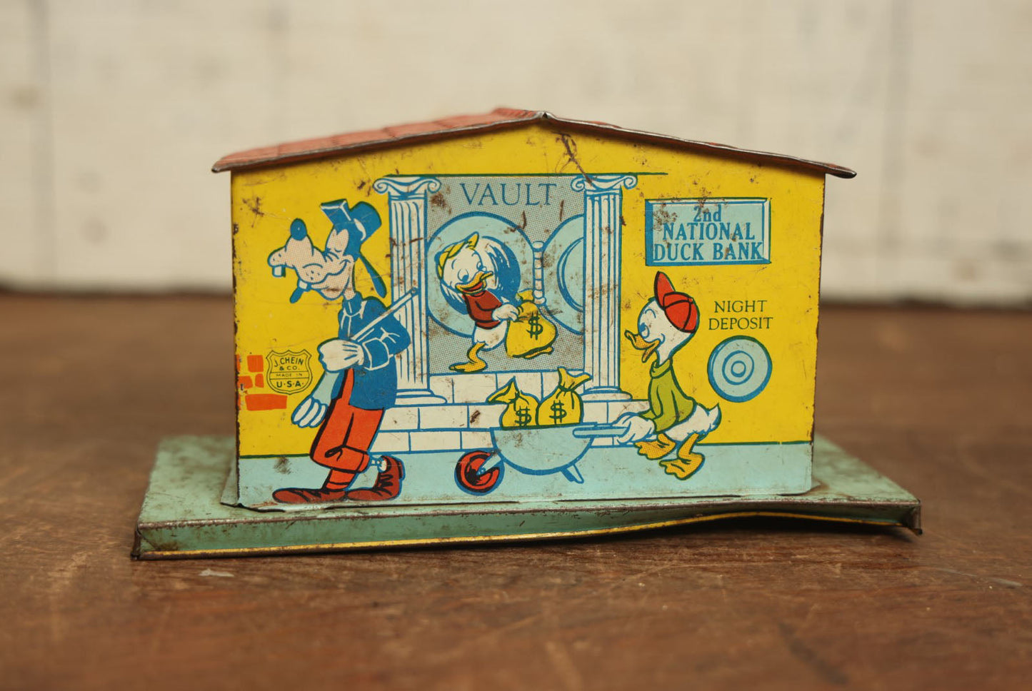 Lot 070 - Vintage Tin Lithograph 2Nd National Duck Walt Disney Bank With Mickey Mouse, Minnie Mouse, Donald Duck, Goofy, Pluto, And Pinnochio, By J. Chein & Co.