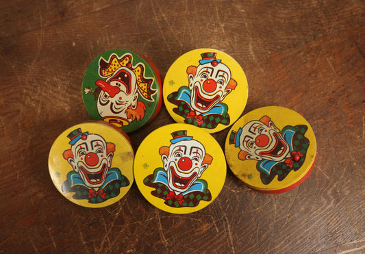 Lot 094 - Grouping Of Five Tin Lithograph Clown Noise Makers By Us Metal Toy Manufacturing Company, Four Yellow And One Green, Spinning Style