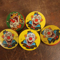 Lot 094 - Grouping Of Five Tin Lithograph Clown Noise Makers By Us Metal Toy Manufacturing Company, Four Yellow And One Green, Spinning Style