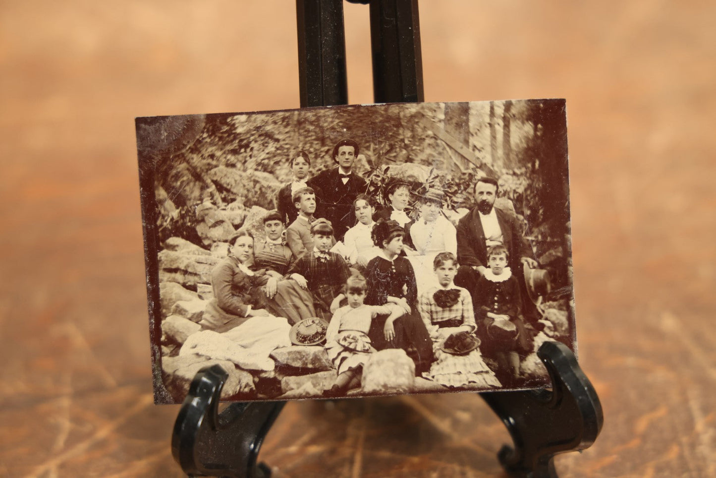 Lot 105 - Grouping Of Three Exterior Tintype Group Photographs With Fourteen People, Same Photo With Different Poses