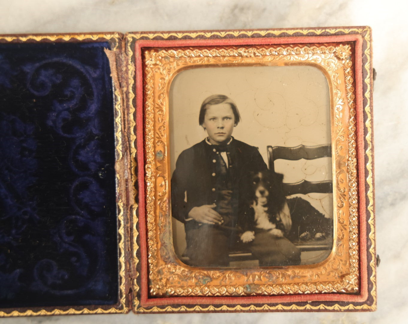 Lot 006 - Antique 1/6th Plate Ambrotype Photograph Of A Young Boy With Spaniel Dog In Full Leatherette Union Case With Blue Purple Pillow