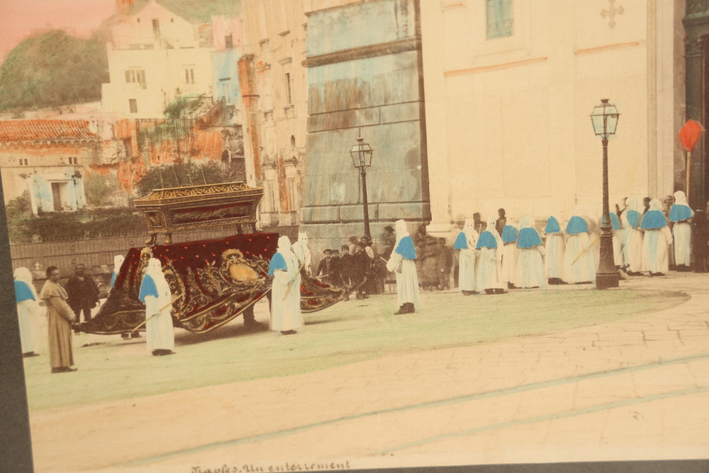 Lot 007 - Antique Hand Colored Boarded Photograph Of A Funeral In Naples, Italy, With Mysterious Hooded Figures, Large Sarcophagus, Titled "Naples, Un Enterrement," In Frame