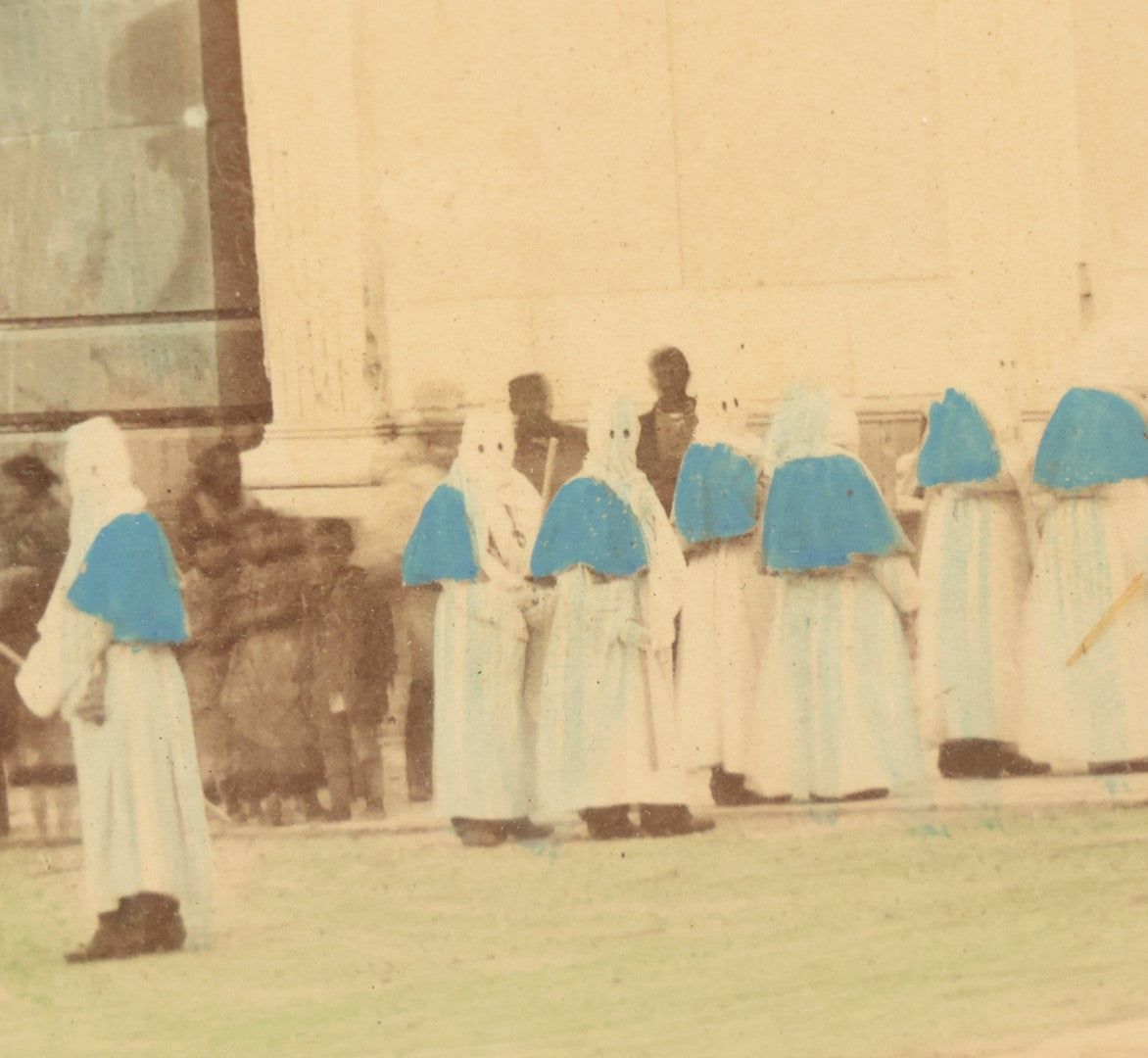 Lot 007 - Antique Hand Colored Boarded Photograph Of A Funeral In Naples, Italy, With Mysterious Hooded Figures, Large Sarcophagus, Titled "Naples, Un Enterrement," In Frame