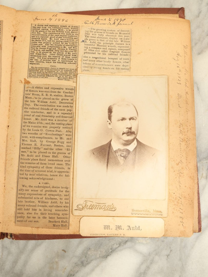 Lot 009 - Short But Interesting Railroad Related Scrapbook With Cabinet Cards And Obituaries Of Conductors, A Hand Drawn Map Of South America, Gravestone Sketch, And More