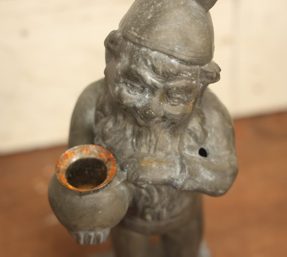 Lot 013 - Vintage Cast Metal Garden Gnome Holding Pot