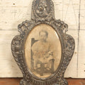 Lot 021 - Antique Tin Frame, Souvenir Of Kansas City, Dated 1910, With Owl And Serpent, Containing A Photo Of A Young Boy Seated In A Chair