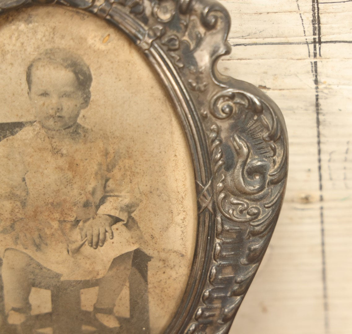 Lot 021 - Antique Tin Frame, Souvenir Of Kansas City, Dated 1910, With Owl And Serpent, Containing A Photo Of A Young Boy Seated In A Chair