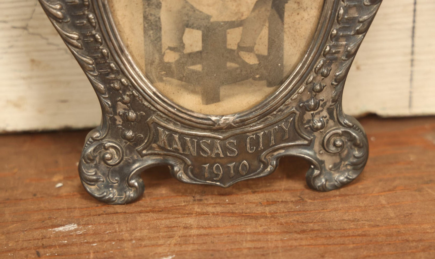 Lot 021 - Antique Tin Frame, Souvenir Of Kansas City, Dated 1910, With Owl And Serpent, Containing A Photo Of A Young Boy Seated In A Chair