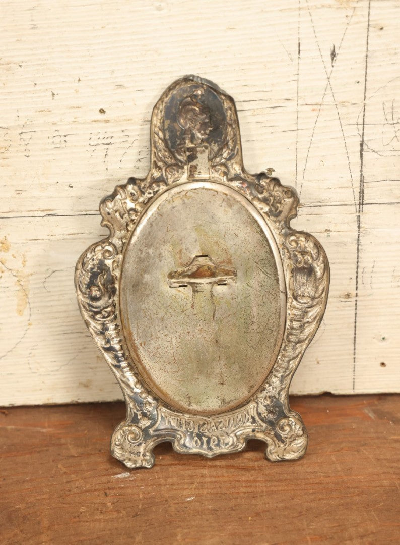 Lot 021 - Antique Tin Frame, Souvenir Of Kansas City, Dated 1910, With Owl And Serpent, Containing A Photo Of A Young Boy Seated In A Chair