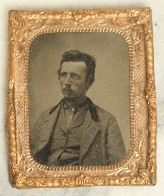 Lot 042 - Antique 1/9Th Plate Tintype In Brass Mat Of A Young Man With Slight Facial Hair, Wearing Shirt And Jacket