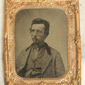 Lot 042 - Antique 1/9th Plate Tintype In Brass Mat Of A Young Man With Slight Facial Hair, Wearing Shirt And Jacket