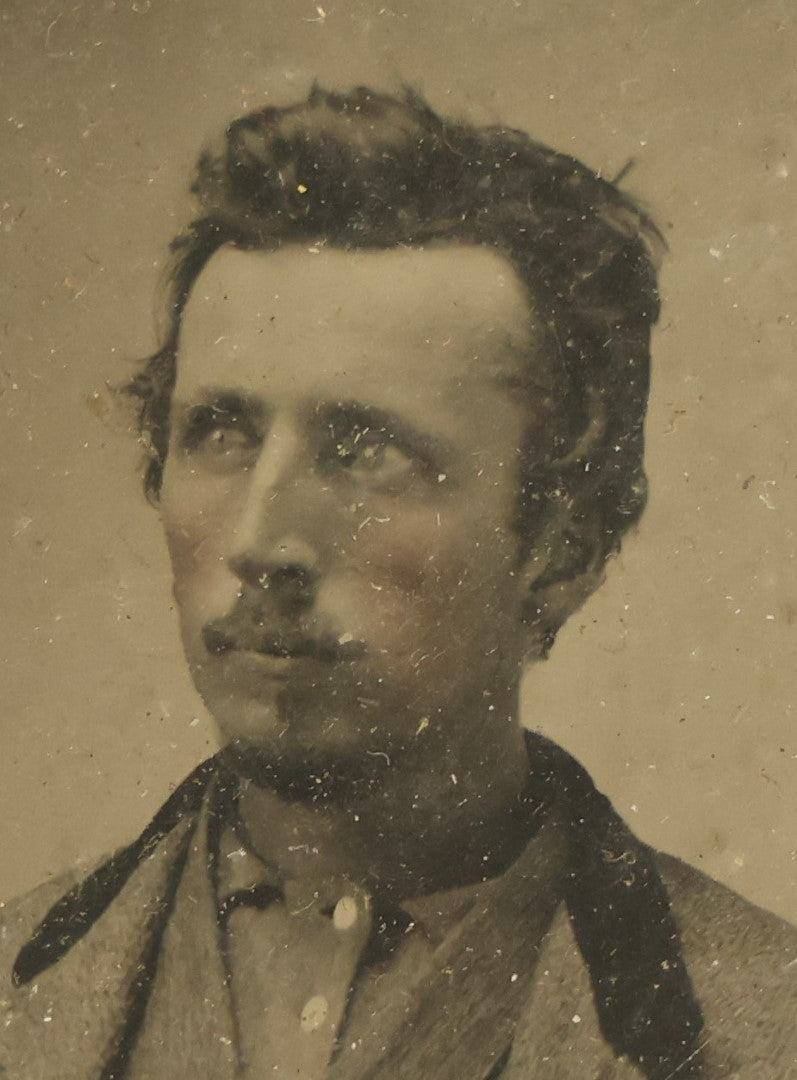 Lot 042 - Antique 1/9th Plate Tintype In Brass Mat Of A Young Man With Slight Facial Hair, Wearing Shirt And Jacket