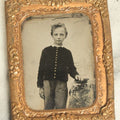Lot 043 - Antique 1/9th Plate Tintype In Brass Mat Of A Young Boy Leaning On A Table With Books Or Photos