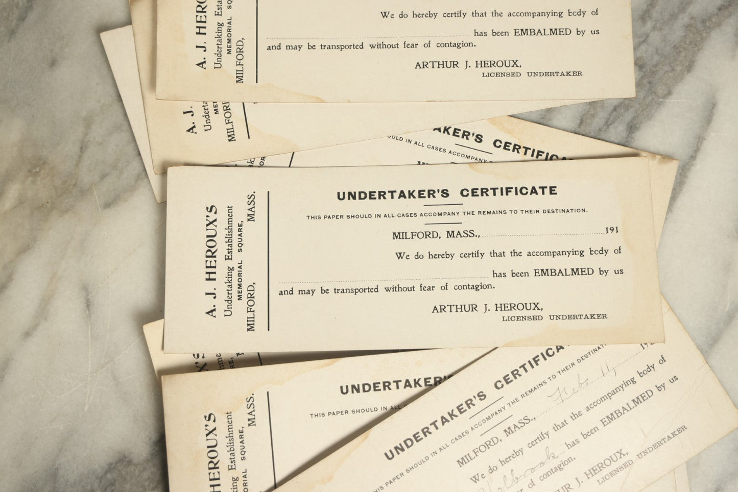 Lot 047 - Grouping Of Nine Blank Antique Undertaker's Toe Tag Certificates From Arthur J. Heroux, Licensed Undertaker, Milford, Massachusetts, Circa 1910