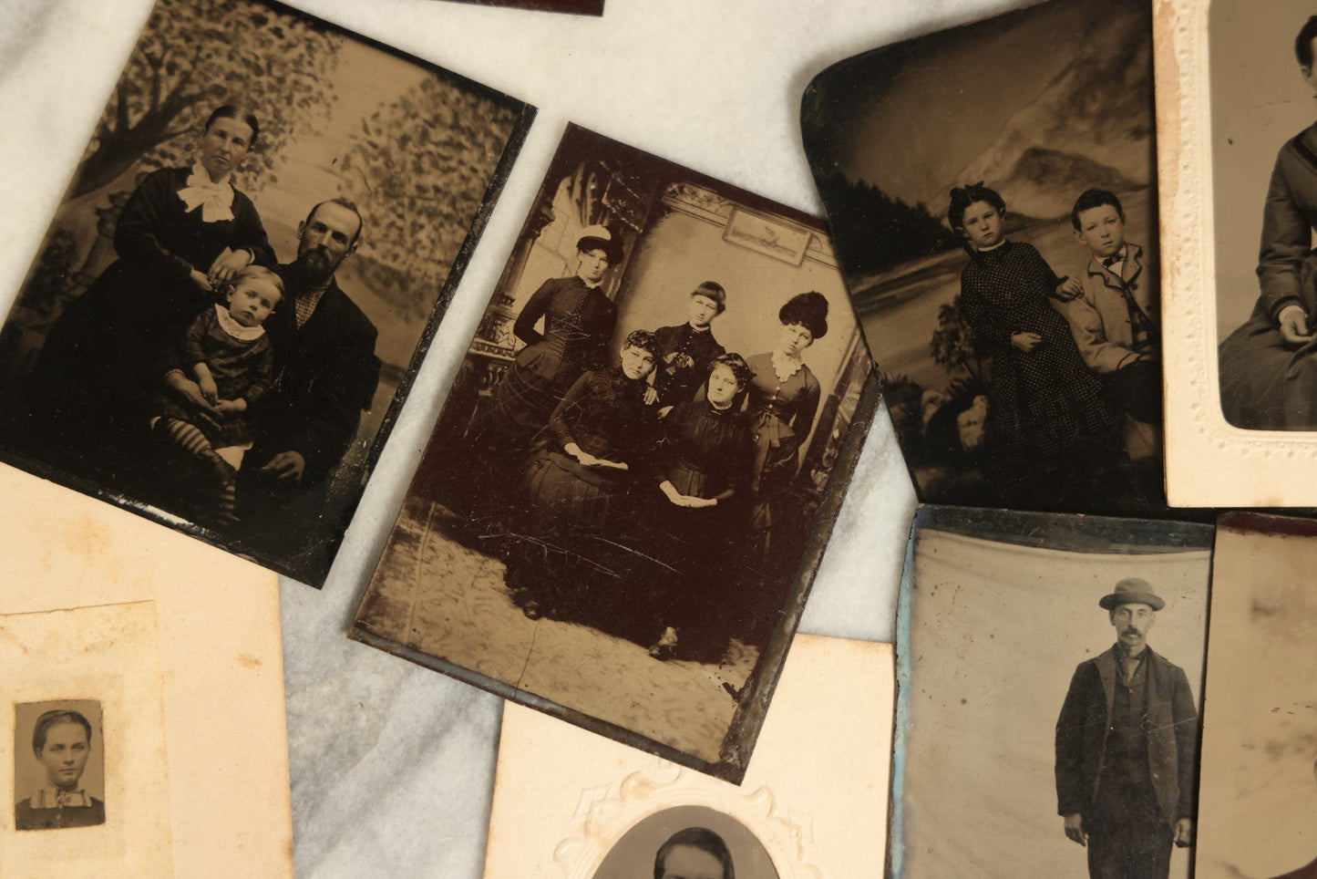 Lot 092 - Grouping Of Antique Tintype Portrait Photographs Of Men, Women, And Children, Including Some With Multiple People, Varying Conditions